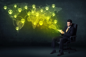 Poster - Businessman in office with tablet and social network world map