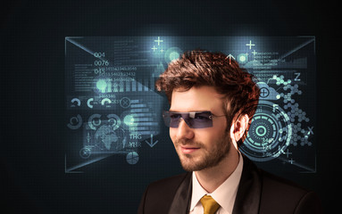 Poster - Young man looking with futuristic smart high tech glasses