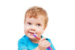 © golovianko - Cute kid brushing teeth isolated on white