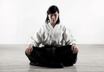 Sticker - beautiful, young woman meditating in a sports hall 1