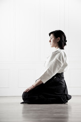 Wall Mural - beautiful, young woman meditating in a sports hall 3