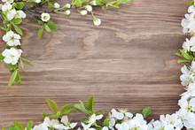 Frame Of Spring Flowers On A Wooden Background.