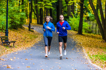 Wall Mural - Healthy lifestyle - woman and man running