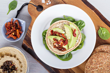 Wall Mural - Vegan sandwich with hummus, avocado and tomatoes