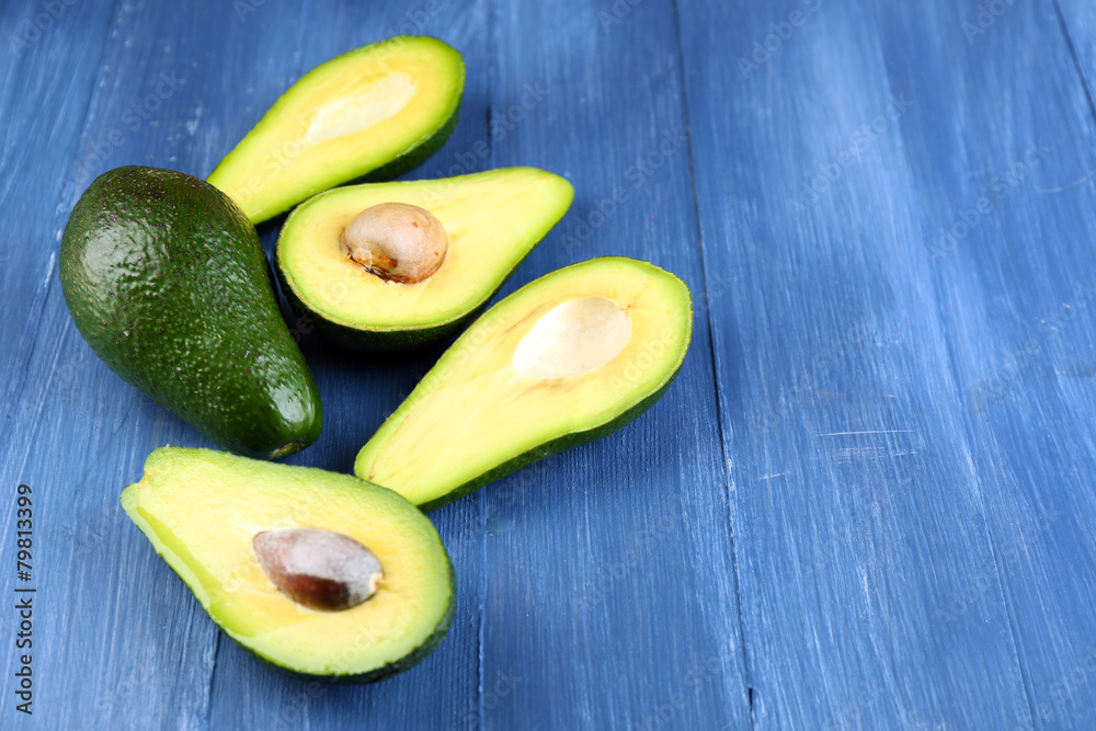 Avocado on wooden background