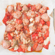 © zoeytoja - uncooked chopped sausages in baking dish