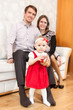 © Kekyalyaynen - Family with toddler girl and two parents indoors
