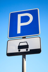 Wall Mural - Blue parking road sign on blue sky background