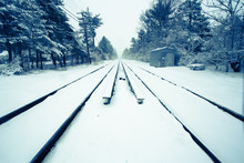 Snow Covered Train Tracks On Cold Morning