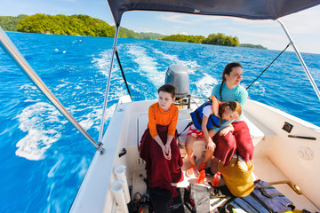 Wall Mural - mother and kids at small boat