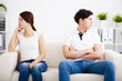 © Tom Wang - young Couple stress and  sitting on the sofa