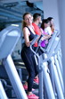 © .shock - woman exercising on treadmill in gym