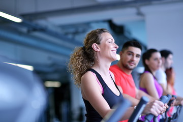 Wall Mural - Group of people running on treadmills