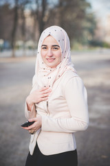 Wall Mural - young beautiful muslim woman at the park