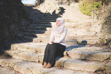 Canvas Print - young beautiful muslim woman at the park