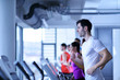 © .shock - Group of people running on treadmills