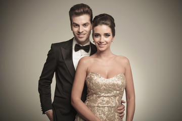 Poster - Portrait of a happy young elegant couple posing