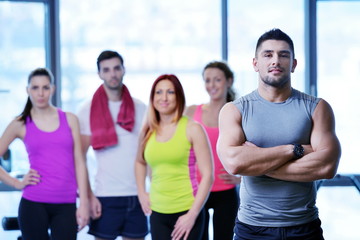 Wall Mural - Group of people exercising at the gym