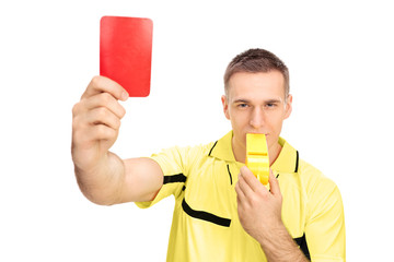 Canvas Print - Referee showing red card and blowing huge whistle