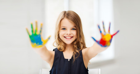 Canvas Print - girl showing painted hands