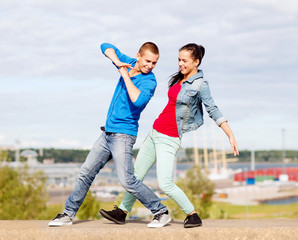 Canvas Print - couple of teenagers dancing outside