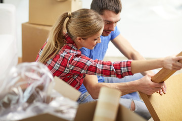 Poster - close up of couple unpacking furniture and moving