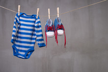 Baby Clothes Hanging On The Clothesline