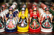 © acceptfoto - Wooden dolls in hungarian folk costumes as souvenir in row