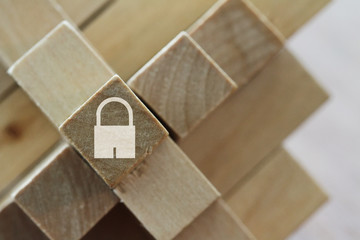 padlock icon on cubic wood puzzle as internet security online bu