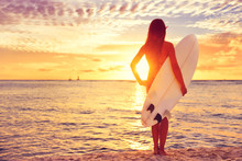 Surfer Girl Surfing Looking At Ocean Beach Sunset