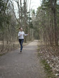 © Konstantin Kulikov - The woman runs on the track in the spring wood