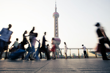 landmark and walking people in Shanghai.