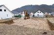 © Westend61 - Europe, Germany, Rhineland Palatinate, Man preparing ground for house foundation