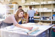 © Westend61 - Young woman in a workshop manufacturing stained glass