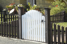 White Garden Gate And Low Fence