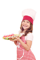 Wall Mural - happy little girl cook hold plate with macarons