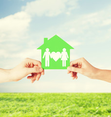 Poster - hands holding green house with family