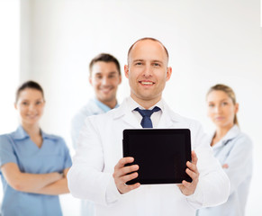 Poster - smiling male doctor with tablet pc