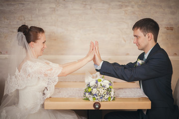 Wall Mural - bride and groom sitting table