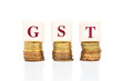 © ThamKC - GST of Goods and Services Tax concept with a stack of coin