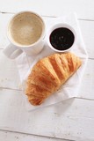 Fototapeta Mapy - fresh baked croissant with coffee