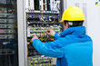 © hxdyl - Man connecting network cables to switches