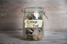 Coins In Jar With College Fund Label
