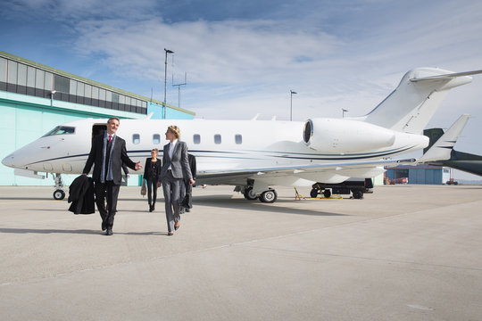 executive business team leaving corporate private jet