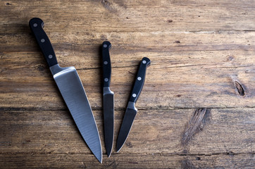 Wall Mural - Knife on rustic kitchen table with copy space