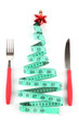 © Africa Studio - Measuring tape and cutlery with Christmas decoration isolated