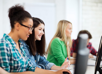 Poster - students with computers studying at school