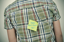 Man With A Sticky Note With The Text Happy April Fools Day