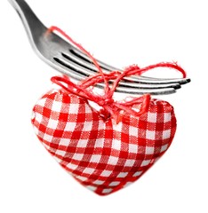 Canvas Print - Dinner. Macro studio image of stainless steel fork with red