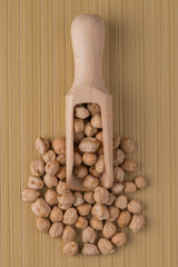 Wall Mural - Wooden scoop with chickpeas